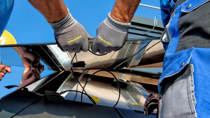 People installing solar panels